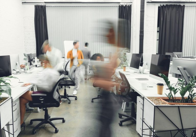 VistaCreate 236024318 stock photo contemporary open space office interior blurred coworkers motion 768x539