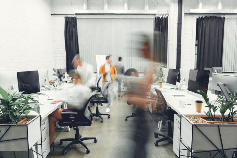 VistaCreate 236024318 stock photo contemporary open space office interior blurred coworkers motion 768x513